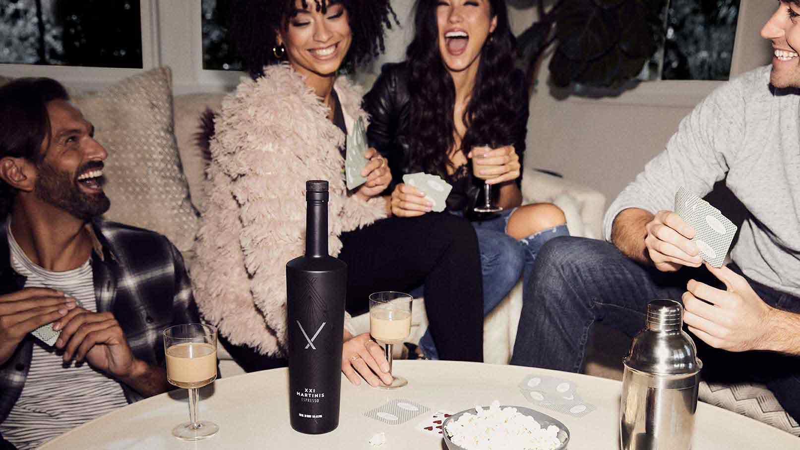 Group laughing, partying, and drinking XXI Martinis